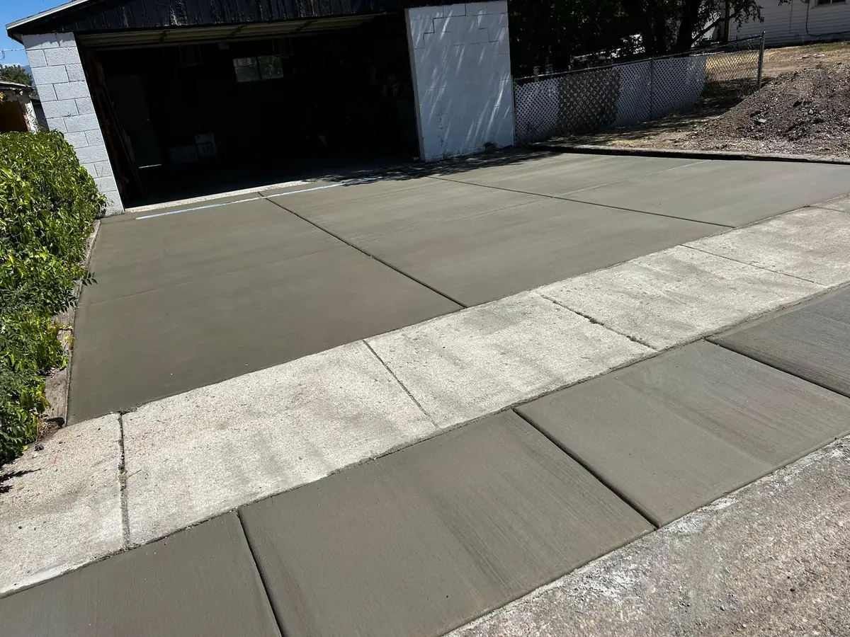 New concrete driveway, garage approach and apron poured by Concrete Plus