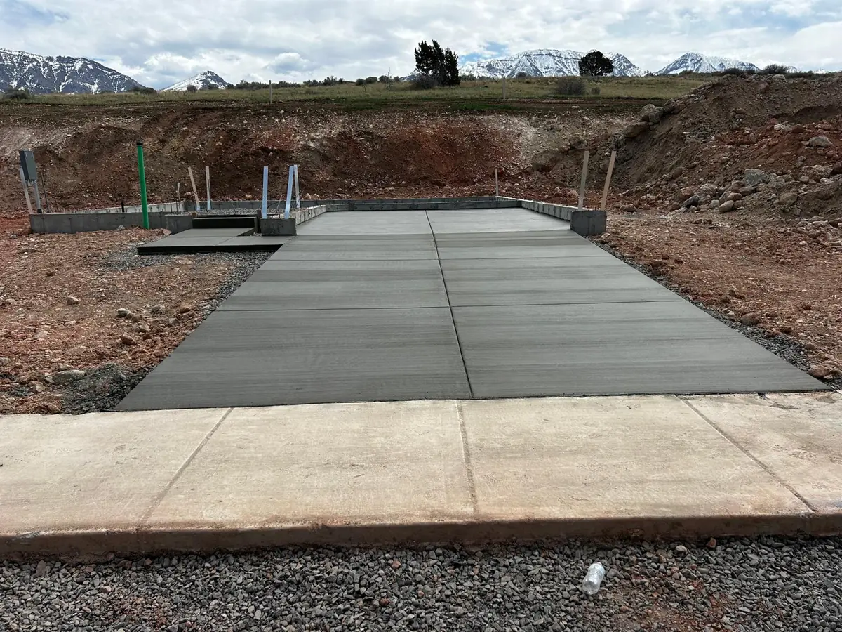 New concrete slab with straight panel joints and foundation walls