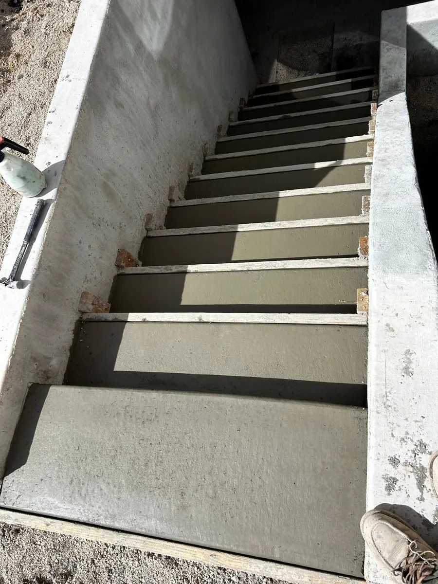 Concrete Plus exterior concrete stairway with freshly finished treads and landing